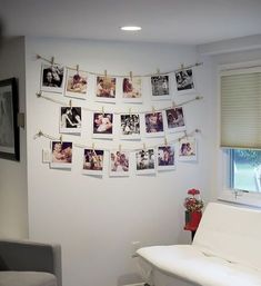 a living room filled with furniture and pictures on the wall