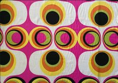 an abstract design with circles on a pink background