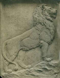 a stone carving of a lion on display