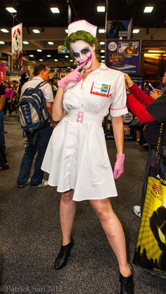 a woman dressed as a nurse is posing for the camera