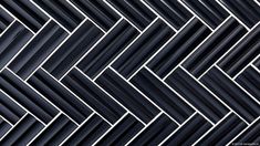 an abstract black and white wallpaper pattern with diagonal lines in the center, as well as