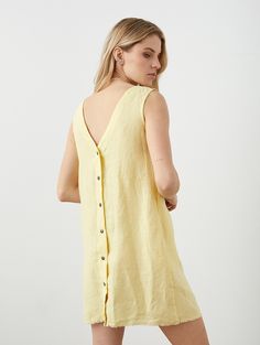 "Linen tank dress with snap fastening all over back. Easy to style, but far from boring with its raw hem and snaps at the back. Offered in medium-weight and exclusive linen. STYLE DETAILS * Regular fit * A-line silhouette * Raw hem detail * V-neck and deep v-back * Snap back * 2 inside pockets * Mini length * Made from medium-weight and exclusive linen SIZES & COLORS IN THE PICTURES * Model 1 is wearing size S in Butter Yellow (medium) linen. Model's height - 176 cm (5'9\"), bust - 83 cm (32.7\" Summer V-neck Dress With Button Back, V-neck Button Back Summer Dress, Summer Daywear Dress With Button Back, Summer Dresses With Button Back For Daywear, Summer Linen Mini Dress With Buttons, Casual Summer Dresses With Button Back, Summer Button Back Mini Dress, Summer Linen Button Dress, Summer Linen Dress With Buttons