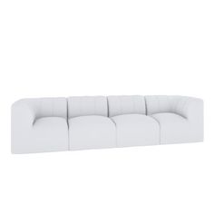 a white couch sitting on top of a white floor