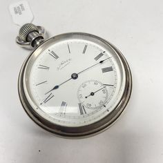 "f885 Antique Waltham A.W.Co Silver Tone Mechanical Pocket Watch Pre-owned item. Please see pictures for details. Sold as is, as seen on pictures, no returns on vintage/antique items. We do not alter/polish antique items and try to keep items as original as possible. Watch were checked and serviced, good working condition. Antique Am Waltham Watch Co Mechanical Pocket Watch. Silver tone. Safety pinion. #3970187 Approx. measurements. 50mm in diameter, 16mm thick. **Please be patient & allow u Waltham Watch, Vintage Clocks, Clock Repair, Mechanical Pocket Watch, Authentic Watches, Pocket Watches, Vintage Clock, Old Antiques, Wristwatch Men