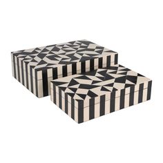 two boxes with black and white designs on the front, one has a geometric design