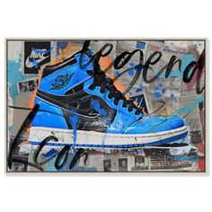 a pair of blue sneakers with graffiti on the wall in front of an advertisement for air jordan