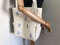 Affordable Everyday Embroidered Canvas Bag, Affordable Embroidered Everyday Canvas Bag, Cheap Embroidered Canvas Tote Bag, Embroidered Canvas Rectangular Shoulder Bag, Embroidered Beige Canvas Bag, Floral Embroidered Cotton Canvas Tote Bag, Elegant Floral Embroidery Tote Bag, Tote Bag Embroidery, Elegant Floral Embroidered Tote Bag