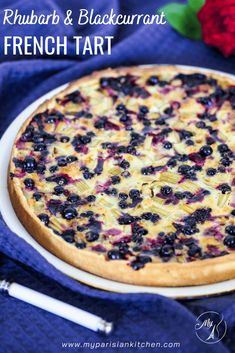 a close up of a pizza on a plate with blueberries and other toppings