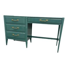 a green desk with two drawers and gold handles