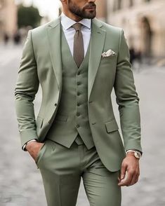 a man in a green suit and tie