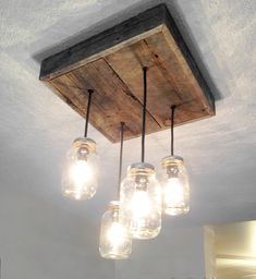 mason jar chandelier hanging from the ceiling