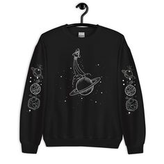 Solar System Sweatshirt - Planet Sweater - Gift for Science Lover - Galaxy Hoodie - Astronaut Space Stars Sweatshirt - Astronomy Sweater  A sturdy and warm sweatshirt bound to keep you warm in the colder months. A pre-shrunk, classic fit sweater that's made with air-jet spun yarn for a soft feel and reduced pilling. * 50% cotton, 50% polyester * Pre-shrunk * Classic fit * 1x1 athletic rib knit collar with spandex * Air-jet spun yarn with a soft feel and reduced pilling * Double-needle stitched c Planet Sweater, Galaxy Sweater, Galaxy Outfit, Galaxy Hoodie, Space Outfit, Astronaut Space, Science Lover, Space Stars, Anime Hoodie