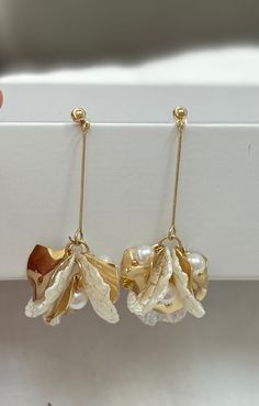 Gold & Shell look drop earrings. Stud backing. Approx 6.5cm long, made from alloy/resin. Ocean-inspired Drop Shell Earrings, Handmade Gold Shell-shaped Earrings, Gold Shell-shaped Earrings, Ocean-inspired Gold Shell Earrings, Gold Dangle Shell Earrings Ocean-inspired, Pearl Shell, Shell Earrings, Gold Pearl, Jewelry Stores