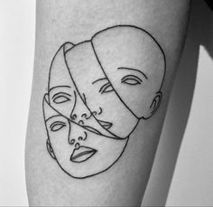 a woman's leg with three faces drawn on it and one has a bandage around her head