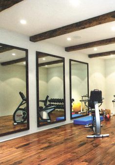 a gym with mirrors and exercise equipment