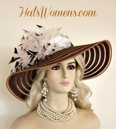 Ladies Brown Wide Brimmed Designer Fashion Special Occasion Kentucky Derby Horse Racing Hat. This Custom Made Church Hat, Is Trimmed With White Feathers With Dark Brown Tips, Enhanced With White Goose Biot Feathers, Accented With White Silk Millinery Roses. This Fashion Hat Can Be Worn With The Roses Toward The Face Or Toward The Back Of The Head. This Hat Is Suited For Formals, Church, Weddings. This Is A Beautiful Hat To Wear To The Kentucky Oak, Kentucky Derby, Preakness Stakes, Melbourne Cup, Royal Ascot, Horse Races, Dress -Up Events, And Special Occasions.

Material: Grosgrain Ribbon Braid And Horsehair Mix

Head Size: 22.5 Inches

Brim Measures 6"

Style: Wide Brim Hat

Condition: New Custom Made - Bespoke Hat

We Specialize In Designer Hats For Women, Hats For Weddings, Custom Made Hat Feathers, Brown Tips, Special Occasion Hats, Mother Of The Bride Hats, Church Lady Hats, Bespoke Hats, Preakness Stakes, Custom Made Hats, Church Weddings