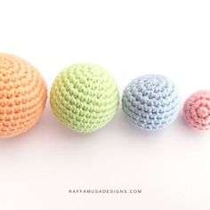 three crocheted balls sitting next to each other