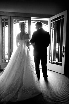 the bride and groom are getting ready to walk down the aisle