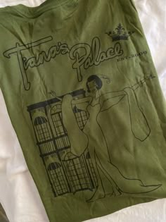 Tiana from The Princess & The Frog celebrates her dream restaurant... TIANA'S PALACE. Dreams do come true! This original double sided design is printed on an ultra soft, comfortable unisex tee in the color of your choice. Each shirt is custom made to order, just for you. Frog T Shirt, Princesa Tiana, Disney Princess Tiana, Disney Designs, Princess Tiana, Princess And The Frog, Dreams Do Come True, Frog T Shirts, The Princess And The Frog