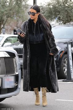 Kim Kardashian wearing Yeezy Season 4 Lace-Up Boots Fur Coats Women