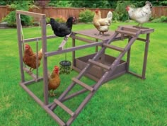 a chicken coop with chickens on it in the grass