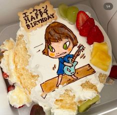 a birthday cake with a girl playing the guitar on it and fruit in the background