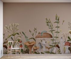 a wall mural with mushrooms and plants painted on it's sides, along with a chair in the foreground