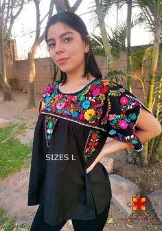 Mexican blouse that Shines you, Fashion as unique as you are. Beautiful blouse made by hand in Chiapas, Mexico creating fashion and art. This is a beautiful blouse with colorful flowers and short sleeve. Very comfortable, Goes great with jeans, leggings, skirt, shorts... Each piece is unique and handmade with dedication and taking care of every detail achieving the best quality in our products, which is why it makes it beautiful and unique each of the embroidered flowers. You can buy the set of Black Floral Embroidered Tops For Festivals, Traditional Black Tops With Floral Print, Black Tops With Floral Embroidery For Festivals, Black Floral Print Festival Blouse, Black Floral Print Blouse For Festival, Folk Style Black Blouse For Summer, Black Folk Style Summer Blouse, Traditional Black Short Sleeve Blouse, Multicolor Embroidered Floral Print Short Sleeve Blouse