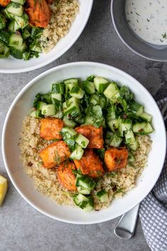 two white bowls filled with vegetables and rice