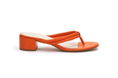 Puffy strap thong sandal on a mini heel. Details: Leather upper. Manmade outsole. 1.5 in / 3.81 cm heel. Leather lining. Padded insole. Slip-on style. Imported. Puffy Leather Sandals, Thong Sandals, Mule, Leather Sandals, Leather Upper, Slip On, Women Shoes, Sandals, Orange