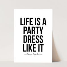 a black and white poster with the words life is a party dress it like it