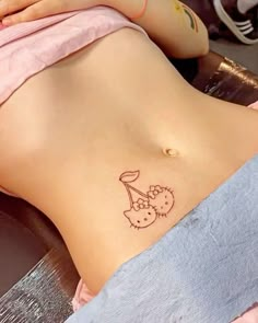 a woman with a tattoo on her stomach