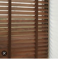 a close up view of wooden blinds in a room