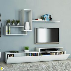 a white entertainment center with shelves on the wall