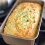 a casserole in a pan sitting on top of a stove