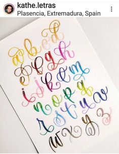 the letters are drawn on paper with colored markers