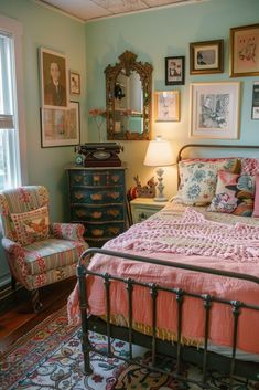 a bed room with a neatly made bed and lots of pictures on the wall above it