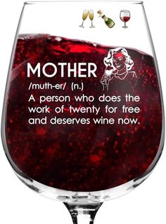 a wine glass filled with red liquid and the words mother in white writing on it