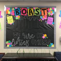 a bulletin board with writing on it in the middle of an office cubicle decorated with balloons and confetti