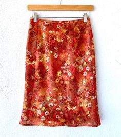 "The Sparkly Shine of this skirt makes me think of fairies in a floral field, very sweet and serene S p e c i f i c s . . . Label: Chastine Tagged Size: -- Approx. Fit: S Color: Coral Pinks // Yellow // White // Red // Greens Material: Metallic Sparkle Fabric // Polyester Lining // Zipper Condition: Overall in Amazing Vintage Condition (Total 1970s style but zipper appears more modern, from 1990s) M e a s u r e m e n t s . . . (side to side // laying flat // closed) Waist - approx 13\" Hips - ap Red Floral Print Pencil Skirt, Fairycore Fitted Skirt For Spring, Red Fitted Skirt With Floral Print, Fitted Red Skirt With Floral Print, Red Fitted Floral Print Skirt, Fitted Red Floral Print Skirt, Vintage Pencil Skirt For Spring, Summer Cottagecore Fitted Skirt, Cottagecore Fitted Summer Skirt