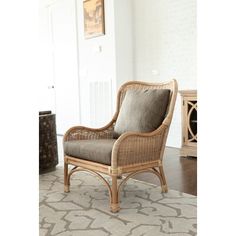 a wicker chair sitting on top of a rug