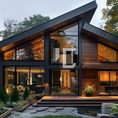 a large house with lots of windows on the front and side of it's roof