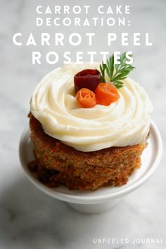 carrot cake with cream frosting on a white plate