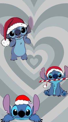 three cartoon characters wearing santa hats and holding candy canes in front of a heart