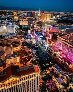 the las vegas strip is lit up at night, with many hotels and casinos in the background