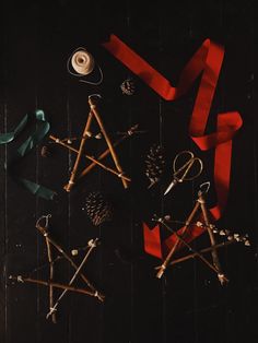 various crafting supplies laid out on top of a wooden table with ribbons and scissors