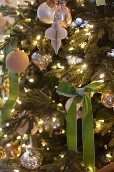 a christmas tree with ornaments hanging from it