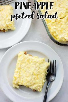 two white plates with slices of pineapple pretzel salad on them, one is cut in half and the other has a fork