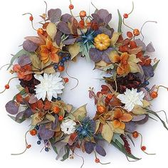 a wreath with orange and white flowers on it