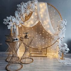 an image of a room decorated with white flowers and fairy lights on the wall behind it